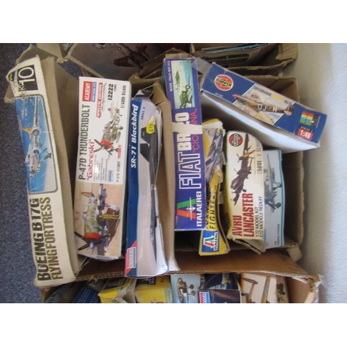 168 - Four boxes containing a large quantity of various model aircraft kits including Airfix, Italeri, Rev... 