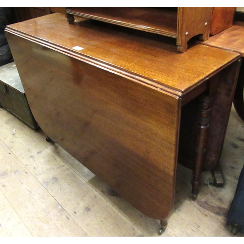 1685 - 19th Century  mahogany drop-leaf dining table raised on turned tapering supports with brass casters