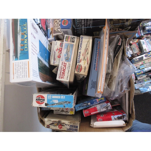 169 - Four boxes containing a large collection of various model aircraft kits including Airfix, Revell, Es... 