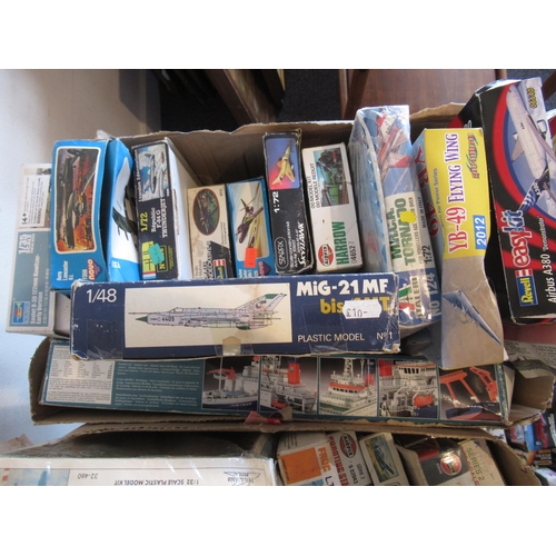 169 - Four boxes containing a large collection of various model aircraft kits including Airfix, Revell, Es... 