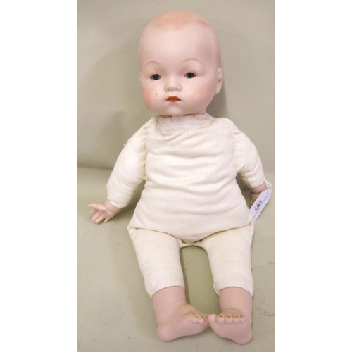 201 - Armand Marseille bisque headed baby doll with soft body and porcelain hands and feet marked AM