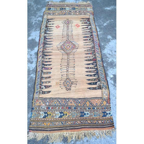 24 - Small Kelim rug with a hooked pole medallion design on a beige ground with skirt panels, 208 x 83cm ... 