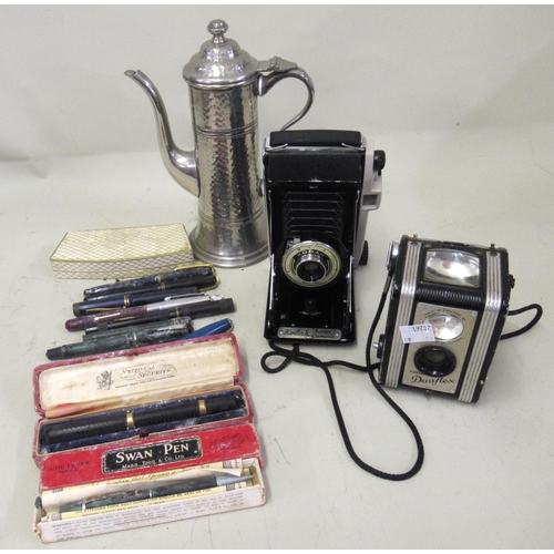 252 - Quantity of various fountain pens, two cameras and a pewter coffee pot