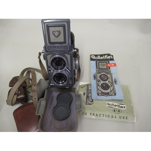 266 - Rolleiflex twin lens camera in two tone grey with original outer case, instruction manuals and a sma... 