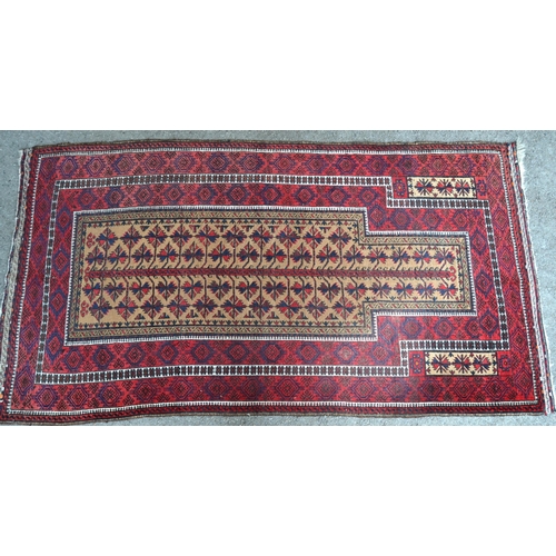 35 - Belouch prayer rug with an all-over stylised flowerhead design on a beige ground, 171 x 93cm (some w... 