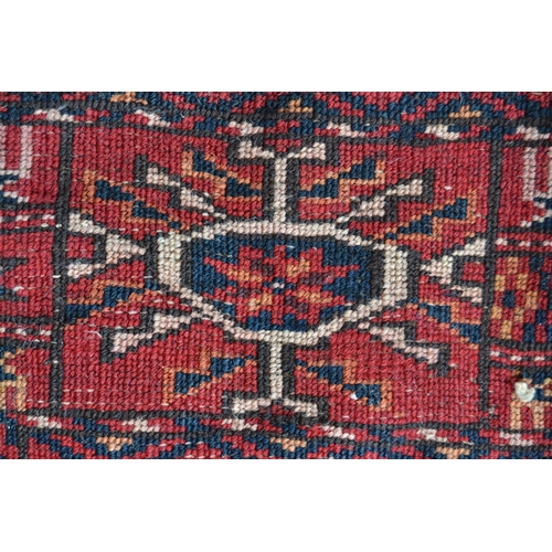 37 - Tekke rug with three rows of nine gols on a wine ground with borders, 206 x 143cm approximately