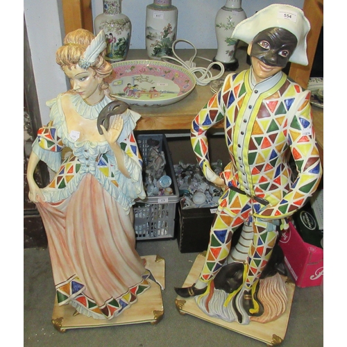 Pair of large modern Italian pottery figures of Harlequin and Columbine, 102cm and 95cm high respectively (damage to the base of Columbine)
