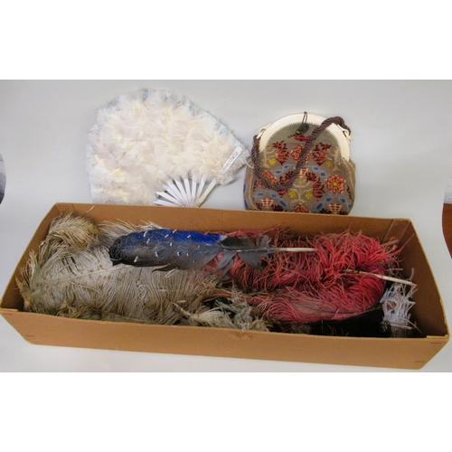 66 - Two boxes containing a quantity of various Victorian dress feathers, a feather fan and a woolwork ba... 