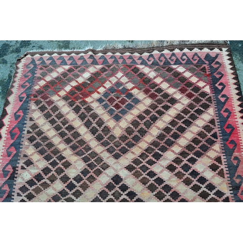 7 - Small Kelim rug with a twin medallion design, in shades of rose, pink, beige and brown, 20cms x 152c... 