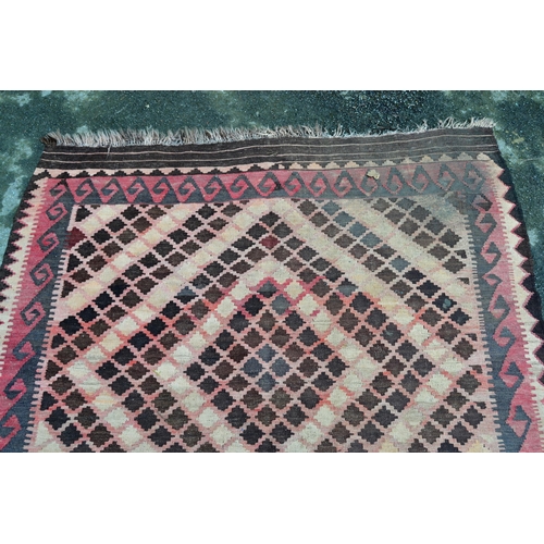 7 - Small Kelim rug with a twin medallion design, in shades of rose, pink, beige and brown, 20cms x 152c... 