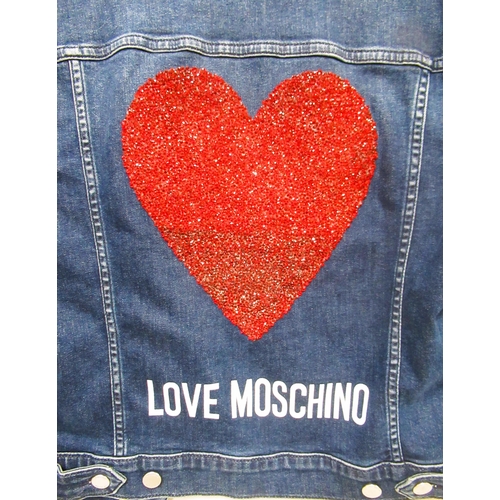 87 - Love Moschino, ladies denim jacket with red embellished heart motif to the back, size 32