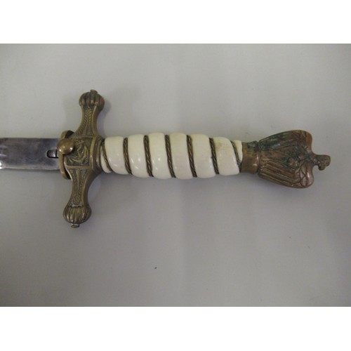 268 - Third Reich Naval officer's dagger with an eagle pommel above a wire bound simulated ivory grip, the... 