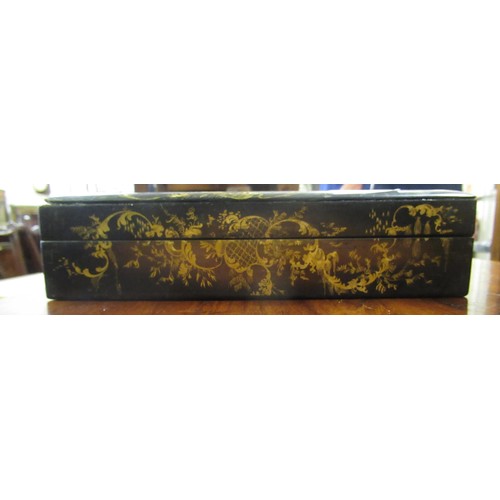 286 - 19th Century black lacquered mother of pearl inset and floral painted games box containing a quantit... 