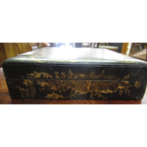 286 - 19th Century black lacquered mother of pearl inset and floral painted games box containing a quantit... 