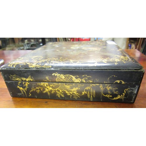 286 - 19th Century black lacquered mother of pearl inset and floral painted games box containing a quantit... 