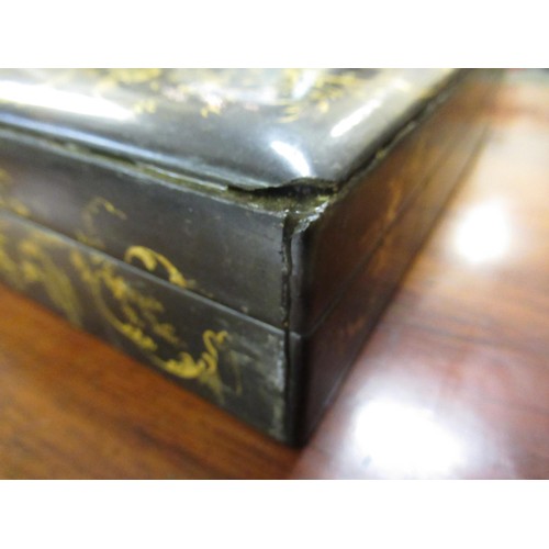 286 - 19th Century black lacquered mother of pearl inset and floral painted games box containing a quantit... 