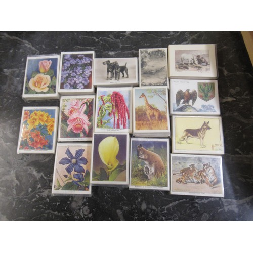 320 - Wooden tray containing a quantity of non standard size cigarette cards in sets