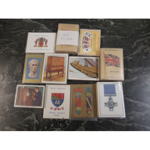 320 - Wooden tray containing a quantity of non standard size cigarette cards in sets