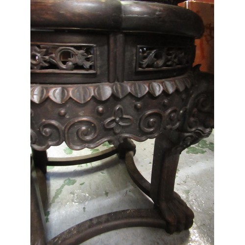 1577 - Chinese circular hardwood marble inset jardinere stand carved with maskheads, 15cm diameter, 47cm hi... 