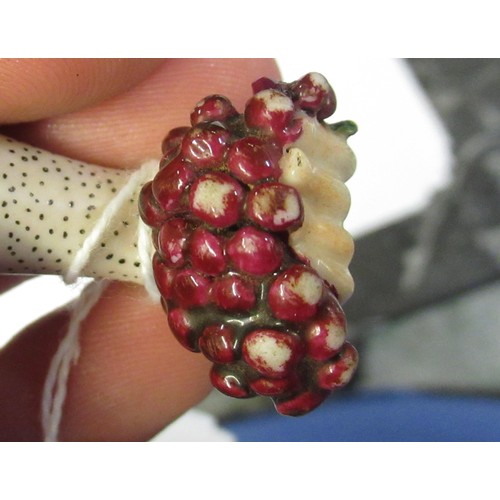 353 - Antique porcelain gilt metal mounted needle case in the form of a lady's arm holding grapes