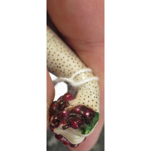 353 - Antique porcelain gilt metal mounted needle case in the form of a lady's arm holding grapes