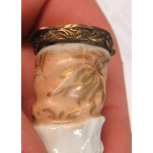 353 - Antique porcelain gilt metal mounted needle case in the form of a lady's arm holding grapes