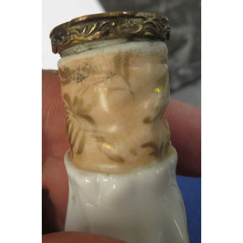 353 - Antique porcelain gilt metal mounted needle case in the form of a lady's arm holding grapes