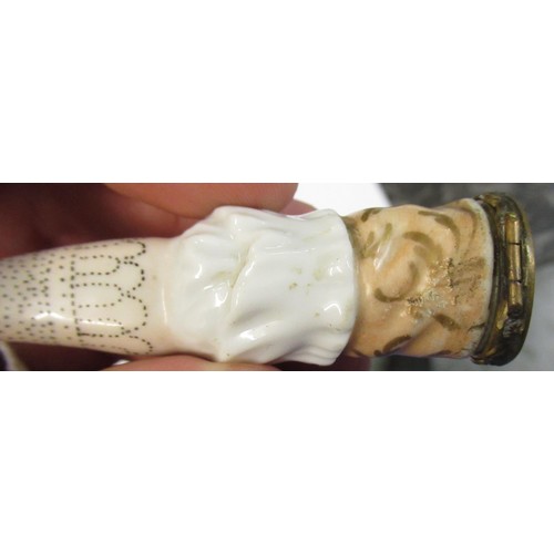 353 - Antique porcelain gilt metal mounted needle case in the form of a lady's arm holding grapes