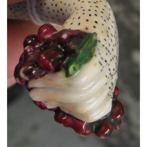 353 - Antique porcelain gilt metal mounted needle case in the form of a lady's arm holding grapes