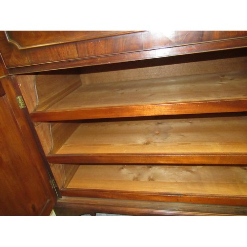 1683 - George III mahogany secretaire bookcase, the moulded cornice above two glazed doors enclosing adjust... 