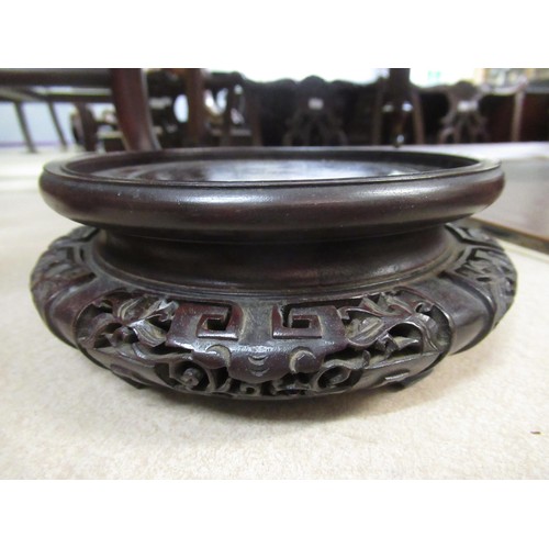 249 - Quantity of various Chinese hardwood carved and pierced circular vase stands