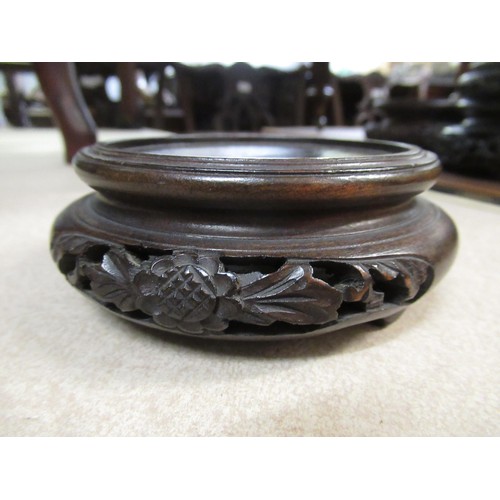 249 - Quantity of various Chinese hardwood carved and pierced circular vase stands