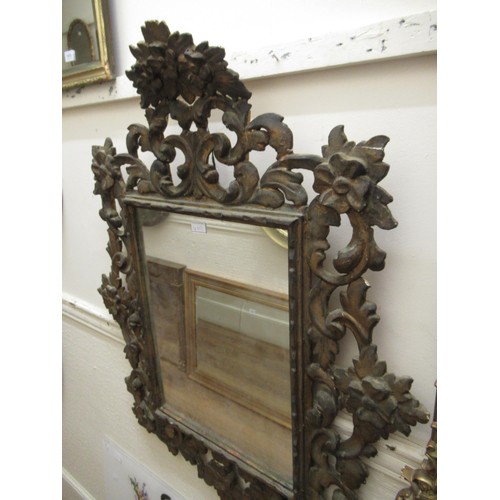 1635C - Late 19th / early 20th Century Continental carved giltwood wall mirror of Florentine design, the pie... 