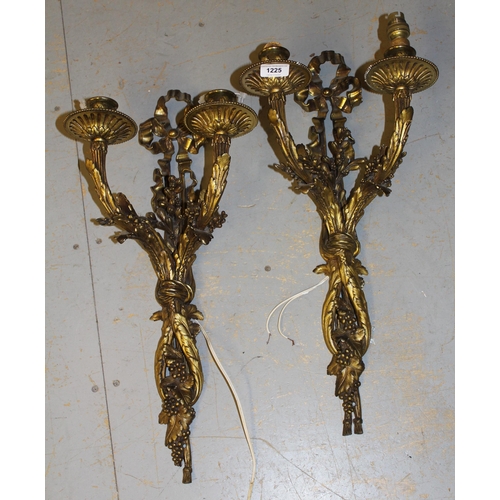 Pair of good quality late 19th / early 20th Century gilt brass twin light wall sconces of fruit, floral and ribbon design, 57cm high