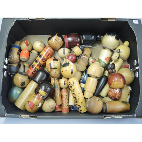 134 - Box containing a collection of various Japanese Kokeshi wooden and painted dolls