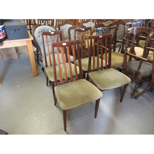 1611 - Set of four G Plan teak dining chairs with slatted backs, upholstered seats on square tapering suppo... 