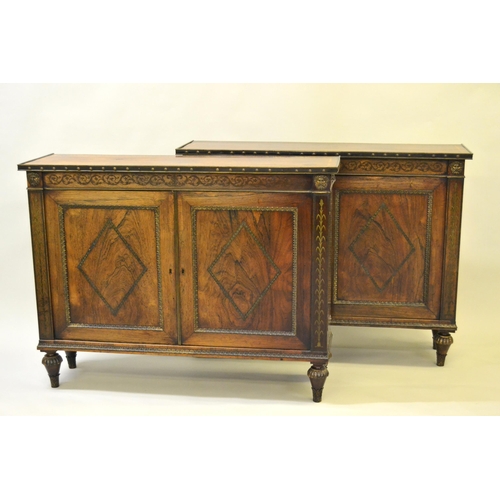 1624 - Pair of Regency rosewood and cut brass inlaid two door side cabinets, each with a brassbound and cro... 