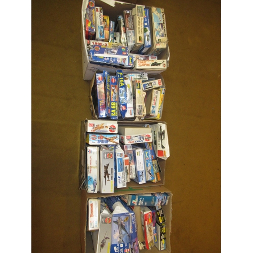 164 - Group of four boxes containing a large quantity of various model aircraft kits, including Revel, Hel... 