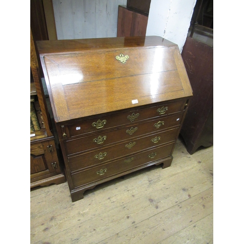 1645 - George III oak bureau, the fall front enclosing a fitted interior above graduated drawers and bracke... 