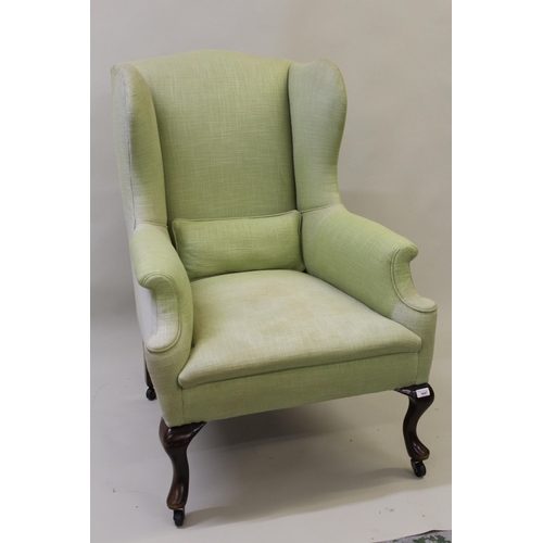 1647 - Early 20th Century upholstered wing armchair in Georgian style on mahogany cabriole supports