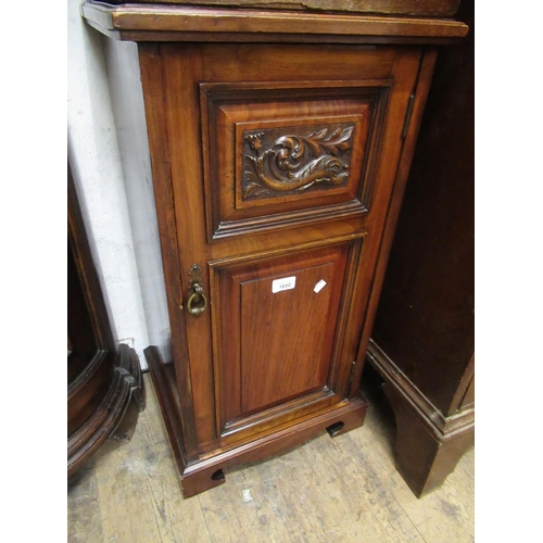 1650 - Late Victorian walnut bedside cabinet with a carved and panelled door