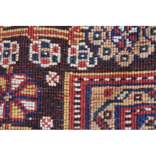 18 - Qashqai rug with a medallion and all-over stylised floral design on a red ground with borders, 243 x... 