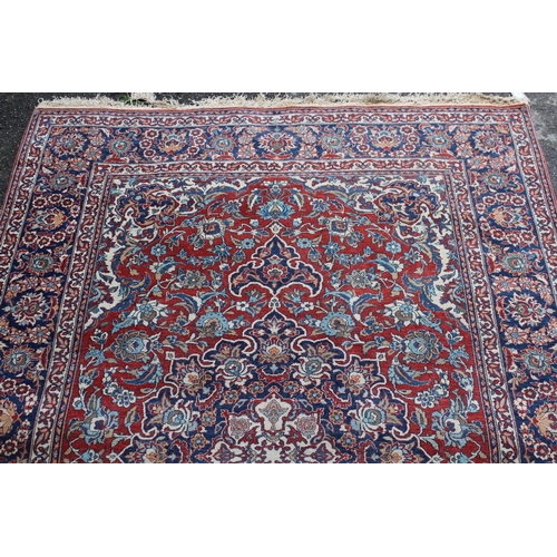 20 - Tabriz rug with a lobed medallion and all-over palmette design on red ground, with palmette borders,... 