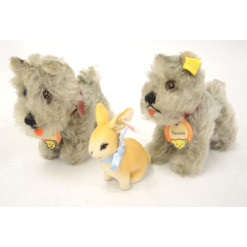 205 - Two small Steiff figures of Tessie dog, together with a small Steiff figure of a rabbit