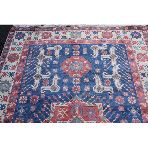 23 - Modern Turkish rug of Caucasian design with a triple medallion and all-over stylised pattern in shad... 