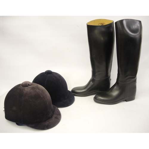 242 - Pair of ladies black leather riding boots, together with two riding hats