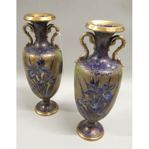 Pair of early 20th Century Carlton Ware floral decorated two handled vases in blue and gilt, 31cm high