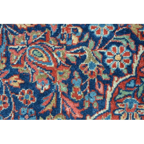 5 - Kashan rug with a busy lobed medallion and floral design on a midnight blue ground with borders, 201... 