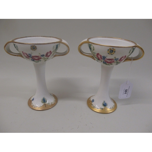 Pair of MacIntyre Moorcroft two handled pedestal vases with stylised floral decoration (one at fault)