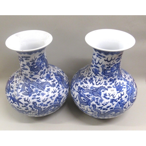 Pair of large 20th Century Chinese baluster form vases blue and white decorated with dragons, signed with seal mark to base, 42cm high